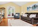 Bright living room with hardwood floors, French doors to outside, and comfortable seating arrangement at 1666 Sam Smith Rd, Fort Mill, SC 29708