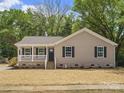 Cozy single-story home featuring a classic front porch, complemented by a newly seeded lawn at 2362 Marett Blvd, Rock Hill, SC 29732