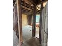An interior view of exposed framework in a home under renovation, door on the right at 334 Whitner St, Rock Hill, SC 29730