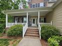 Inviting front porch with white railings and brick steps leading to the front door at 4203 Flint Dr, Lancaster, SC 29720