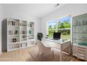 Bright office space with built-in shelves, a modern desk, and a large window view at 5125 Carden Dr, Charlotte, NC 28227