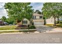 Traditional two-story home with a well-maintained front yard at 6001 Pine Cone Ln, Monroe, NC 28110