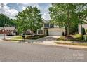 Classic two-story home featuring a neatly landscaped front lawn at 6001 Pine Cone Ln, Monroe, NC 28110