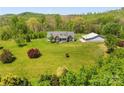Expansive view of the beautiful home and surrounding acreage and outbuilding at 1046 Linneys Mill Rd, Union Grove, NC 28689