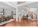 Elegant foyer with gleaming hardwood floors, a grand staircase, and an open layout, perfect for entertaining at 110 Preserve Way, Mooresville, NC 28117