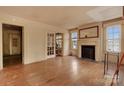 Spacious living room featuring hardwood floors and a decorative fireplace at 114 S 5Th St, Albemarle, NC 28001