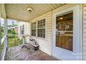 Inviting front porch with ample natural light and access to the main entrance door at 1221 Patterson St, Shelby, NC 28152