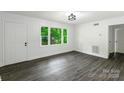 The bedroom is bright with vinyl wood floors at 1750 Oak Valley Dr, Gastonia, NC 28054