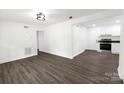 The living room is bright and airy, features vinyl wood floors at 1750 Oak Valley Dr, Gastonia, NC 28054