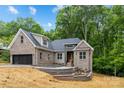 Attractive house with landscaped front yard and a blend of brick and siding at 2108 Lakeview Cir, Matthews, NC 28105