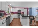 Modern kitchen with white cabinets, granite counters, and stainless appliances at 250 Log Barn Rd, Salisbury, NC 28146