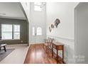 Bright foyer with hardwood floors, a high ceiling, and a charming decorative table at 306 Fesperman Cir, Troutman, NC 28166