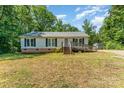 Exterior view of a charming single-story home with a ramp and a well-maintained front yard at 3442 Cedar Circle Rd, Lancaster, SC 29720