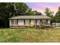 Quaint one-story home with a charming entrance and well-lit exterior at 3442 Cedar Circle Rd, Lancaster, SC 29720