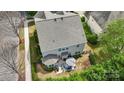 Backyard view with patio, grill, and lush landscaping at 8200 Sunset Hill Rd, Waxhaw, NC 28173