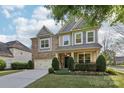 Beautiful two-story home with well-maintained landscaping at 8200 Sunset Hill Rd, Waxhaw, NC 28173