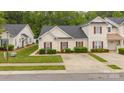 Charming single-story home with cream siding, red shutters and well-maintained landscaping at 8313 Carob Tree Ln, Charlotte, NC 28215