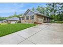 Beautiful home features an attached two-car garage and a long concrete driveway at 876 Hardin St # B24, Lancaster, SC 29720