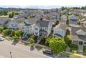 Aerial view of neighborhood featuring a charming blue two-story home with landscaped front yard and inviting front porch at 962 Herrons Ferry Rd, Rock Hill, SC 29730