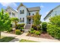 Charming blue two-story home with landscaped front yard and inviting front porch in a suburban setting at 962 Herrons Ferry Rd, Rock Hill, SC 29730