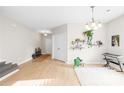 Bright open-concept living room with hardwood floors and decorative shelving at 105 Altondale Dr, Statesville, NC 28625