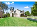 A well maintained lawn and landscaping highlight this two story home with an attached garage at 106 Sweet Briar Dr, Fort Mill, SC 29707