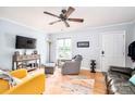 Inviting living room with hardwood floors, ceiling fan, comfortable seating, and bright natural light at 1404 River Dr, Belmont, NC 28012