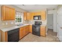 Efficient kitchen has stainless steel appliances and plenty of counter space at 14311 Riding Hill Ave, Charlotte, NC 28213