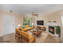 Inviting staged living room boasts natural light, a fireplace, and stylish decor at 14311 Riding Hill Ave, Charlotte, NC 28213