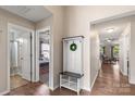 Open hallway with hardwood floors, coat rack and access to multiple rooms at 1680 Beleek Ridge Ln, Clover, SC 29710