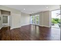 Bright bedroom with hardwood floors and a private balcony offers ample natural light at 2200 Lyndhurst Ave # 203, Charlotte, NC 28203