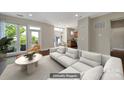 Staged living room boasts a large window view, hardwood floors, and modern furniture at 2200 Lyndhurst Ave # 203, Charlotte, NC 28203