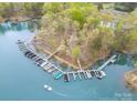 Aerial view showcases a boat dock with multiple slips, offering convenient lake access for boating enthusiasts at 2620 Shady Reach Ln, Charlotte, NC 28214