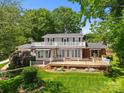 Charming home showcasing a lovely outdoor deck and second story balcony, perfect for entertaining at 273 Leeward Point Loop # 14, Taylorsville, NC 28681