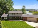 Traditional home exterior with brick accents, manicured lawn, and a two-car garage at 273 Leeward Point Loop # 14, Taylorsville, NC 28681
