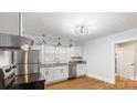 Clean, bright kitchen featuring stainless steel appliances, sleek cabinets, and modern lighting fixtures at 331 5Th Se Ave, Hickory, NC 28602