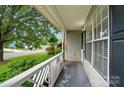 Cozy porch overlooking the street, offering a tranquil outdoor space with white railing at 519 Jacobs Rdg, Fort Mill, SC 29715