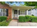 Welcoming front porch with brick accents and neat landscaping, perfect for relaxing at 519 Jacobs Rdg, Fort Mill, SC 29715