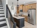 Modern kitchen boasts stainless appliances, granite countertops, and an island, perfect for cooking and entertaining at 6009 Countess Dr # 50, Charlotte, NC 28217