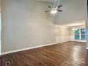 Spacious living room featuring hardwood floors, high ceilings, and natural light at 7401 Kinsmore Ln, Charlotte, NC 28269