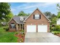 Beautiful brick home with a two-car garage, well-maintained lawn, and classic architectural details creates curb appeal at 2478 23Rd Ne St, Hickory, NC 28601