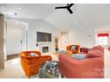 Bright living room with a fireplace, cozy seating, and plenty of natural light at 2810 Berry Creek Rd, Charlotte, NC 28214