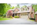 Inviting brick facade, a well-manicured lawn, and a spacious two-car garage create a welcoming curb appeal at 4600 Spicewood Dr, Charlotte, NC 28227