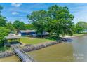 Picturesque waterfront property with a charming gazebo, private dock, and lush greenery, offering serene views at 5200 Masons Ferry Rd, Clover, SC 29710