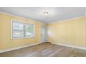 Bright living room featuring new flooring, neutral paint, a stylish light fixture, and ample natural light at 634 7Th Avenue Se Pl, Hickory, NC 28602