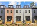 Exterior view of modern townhomes, showcasing their unique architectural design and individual entrances at 1354 Briar Creek Rd, Charlotte, NC 28205