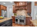 Gourmet kitchen boasts stainless steel appliances, a large island, and custom cabinetry at 21305 Sandy Cove Rd, Cornelius, NC 28031