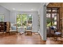 Bright living area featuring hardwood floors, natural light, and neutral colors at 21305 Sandy Cove Rd, Cornelius, NC 28031
