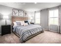 Serene main bedroom with neutral walls, plush carpeting, and two windows providing natural light at 5224 Mccallum Meadows Dr, Charlotte, NC 28216