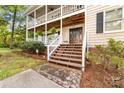 Inviting front entrance with stairs leading to a charming double porch and a beautifully designed front door at 552 Blue Rock Dr, Charlotte, NC 28213